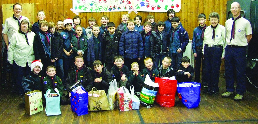 43rd Glasgow Scouts and Leaders in their hall with some of the donated presents. PIC: John Maclean